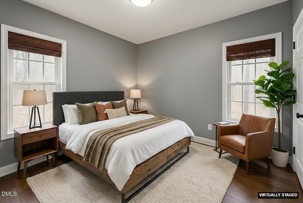 2733 Will Lucas Road Spring Lake, NC 28390 - Photo 16 of 25 a bedroom with bed and a window with potted plant