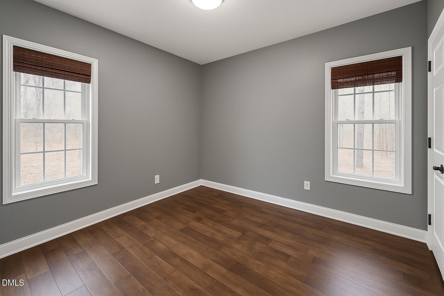 2733 Will Lucas Road Spring Lake, NC 28390 - Photo 17 of 25 an empty room with wooden floor and windows