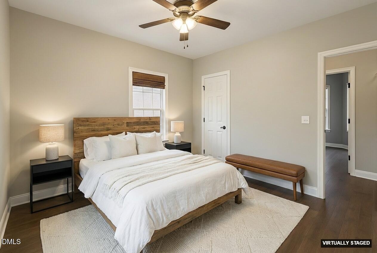 2733 Will Lucas Road Spring Lake, NC 28390 - Photo 18 of 25 a bedroom with a bed and a chandelier