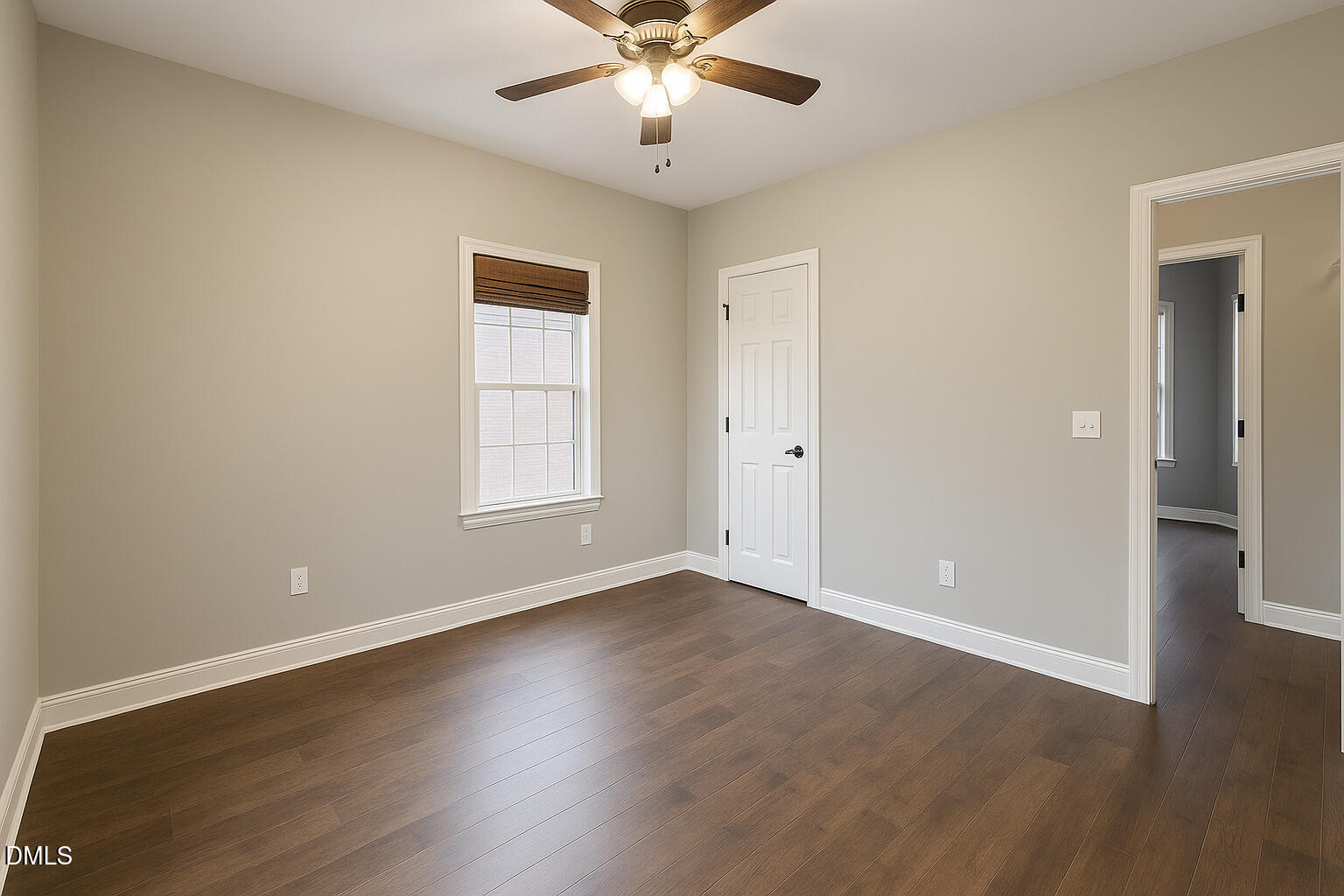 2733 Will Lucas Road Spring Lake, NC 28390 - Photo 19 of 25 an empty room with wooden floor chandelier fan and windows