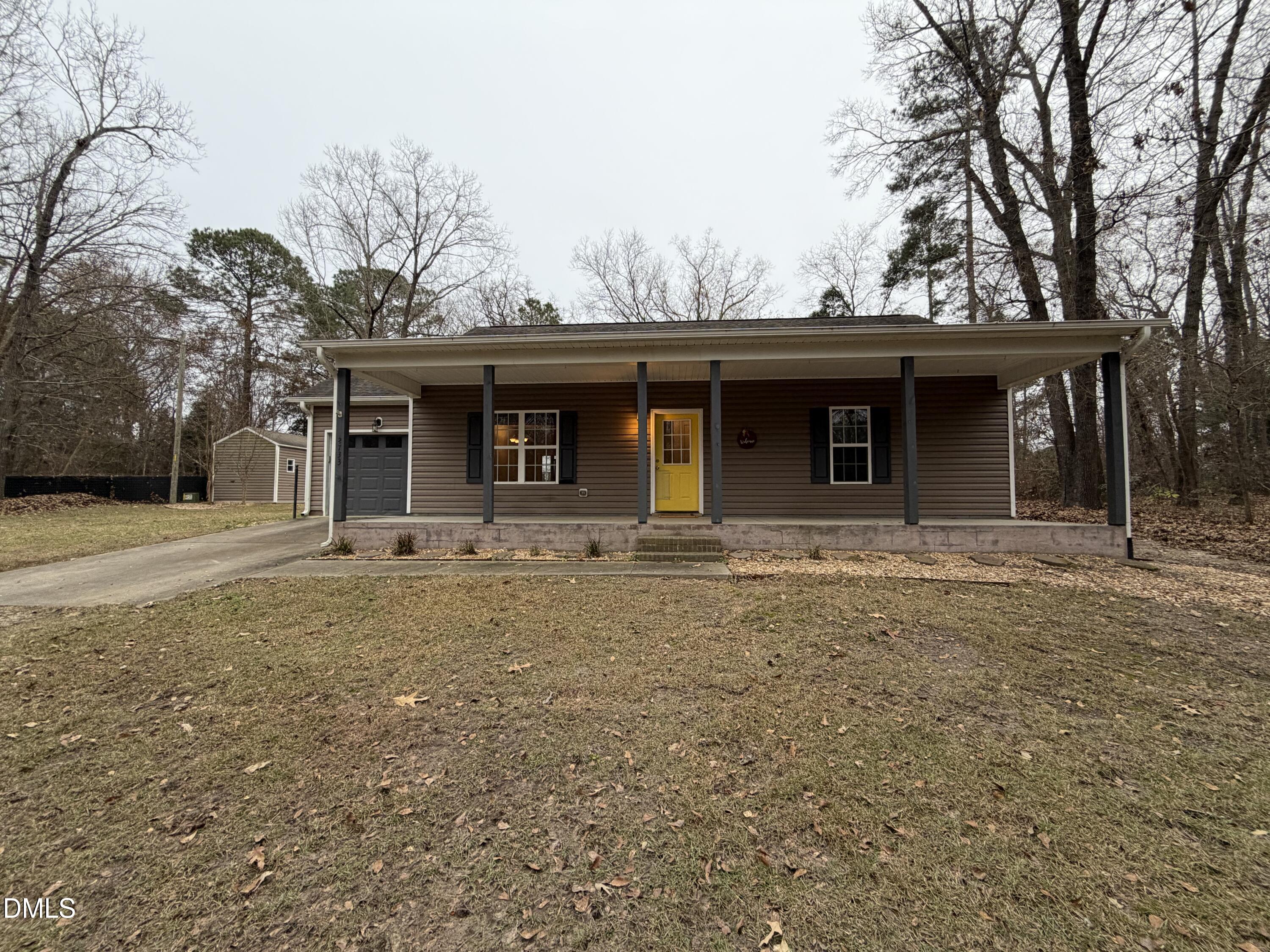 2733 Will Lucas Road Spring Lake, NC 28390 - Photo 2 of 21 a front view of a house with yard