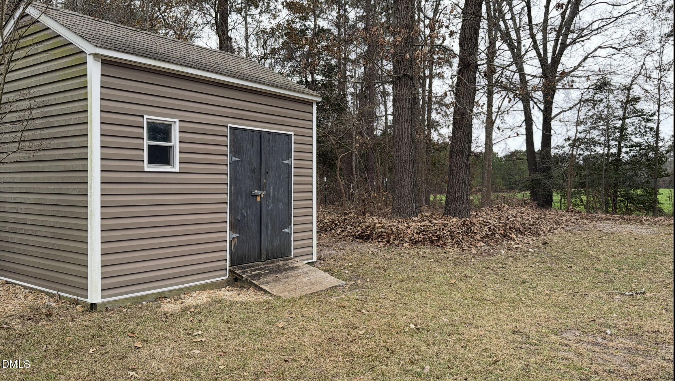 2733 Will Lucas Road Spring Lake, NC 28390 - Photo 24 of 25 a view of a house with a yard