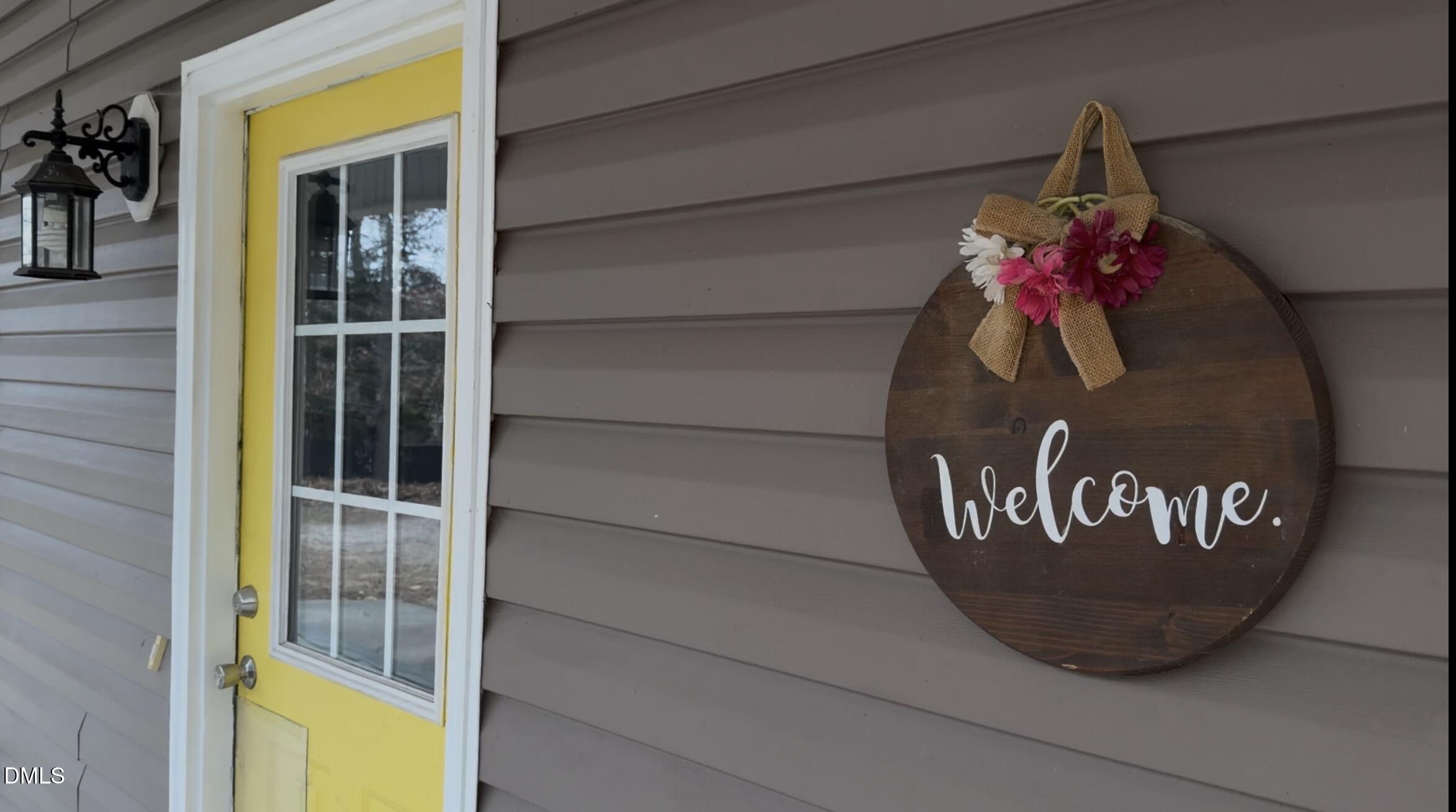 2733 Will Lucas Road Spring Lake, NC 28390 - Photo 4 of 21 a view of a door and a potted plant