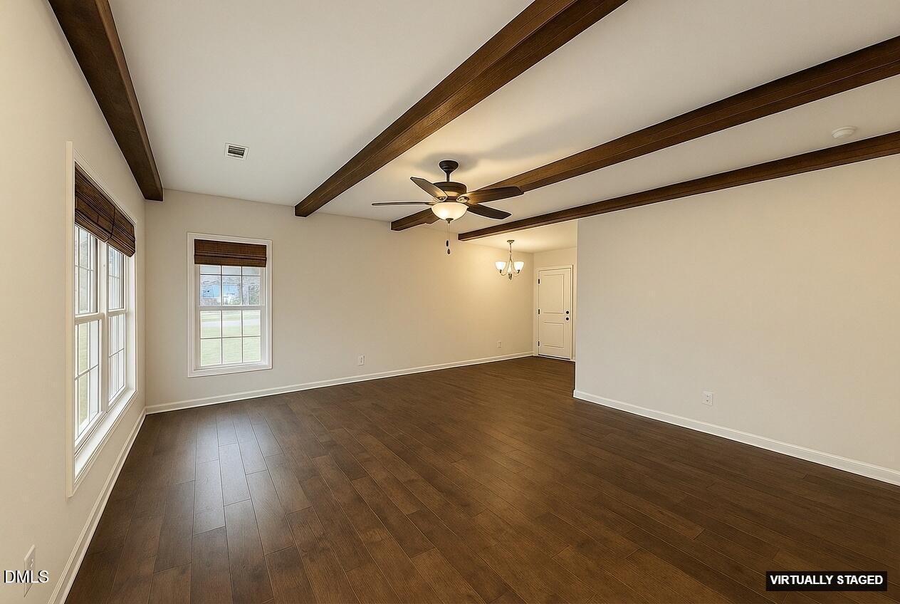 2733 Will Lucas Road Spring Lake, NC 28390 - Photo 5 of 25 a view of an empty room with wooden floor and a window