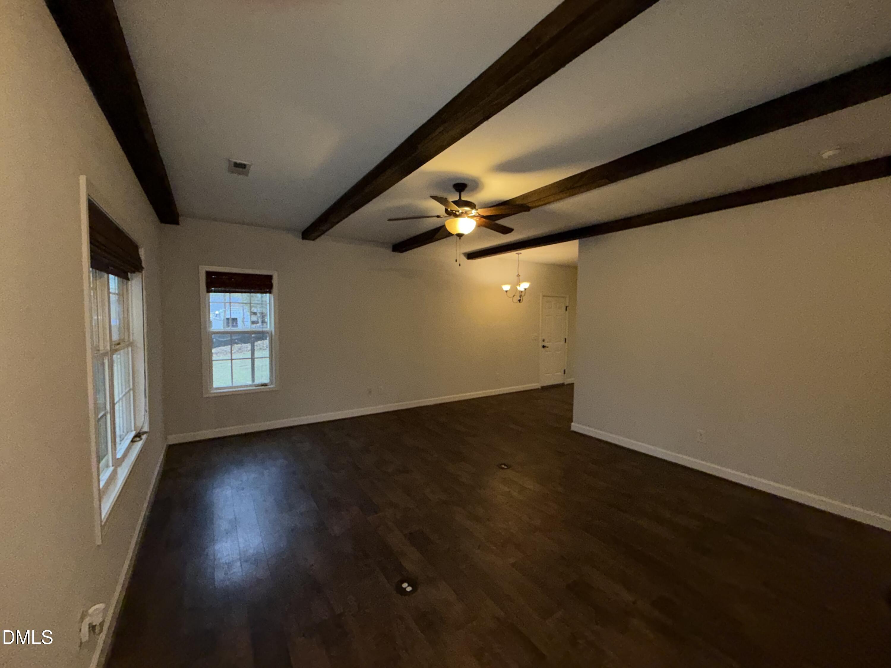 2733 Will Lucas Road Spring Lake, NC 28390 - Photo 5 of 21 an empty room with wooden floor and windows