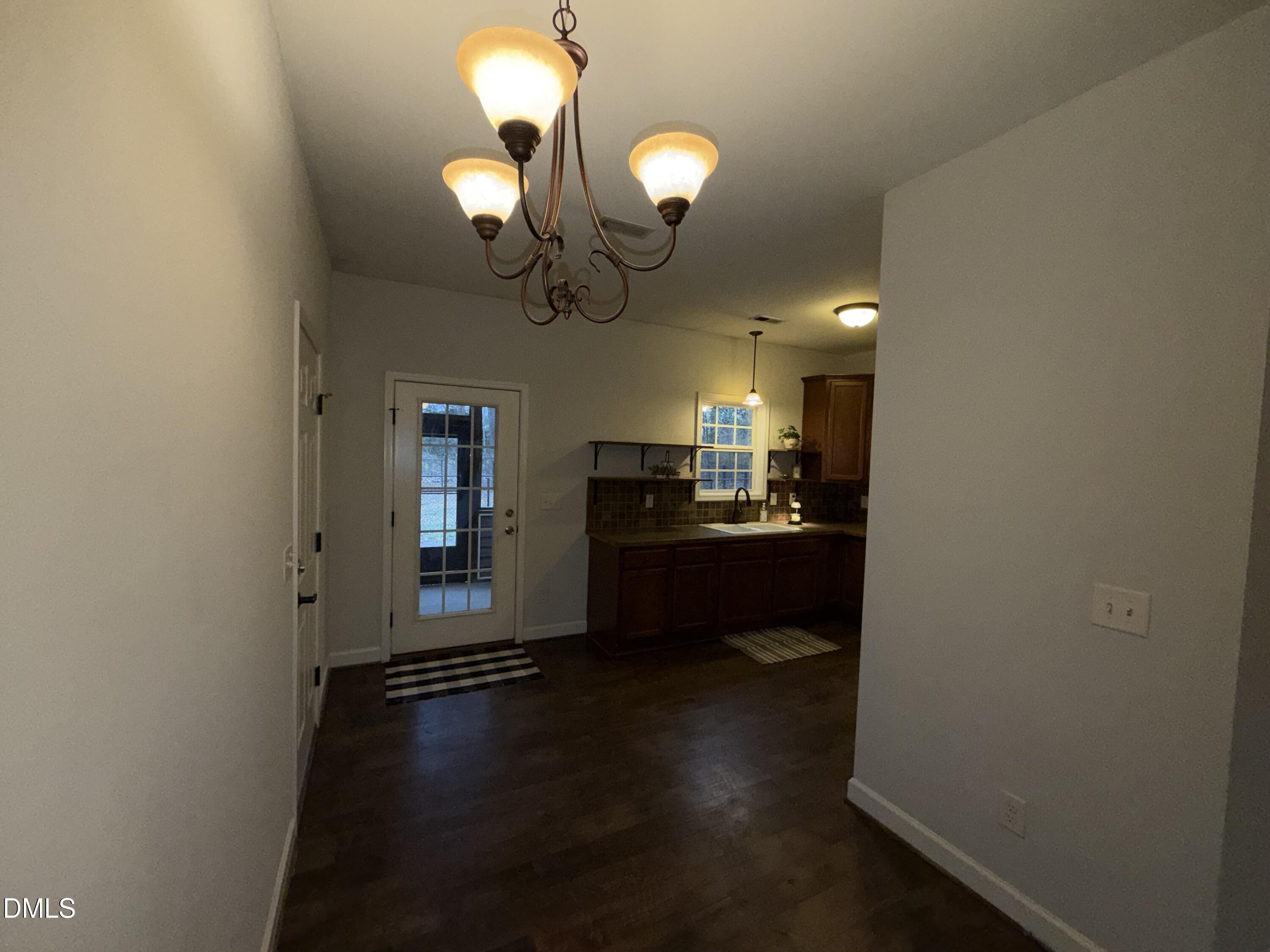 2733 Will Lucas Road Spring Lake, NC 28390 - Photo 6 of 21 a view of a room with wooden floor and staircase