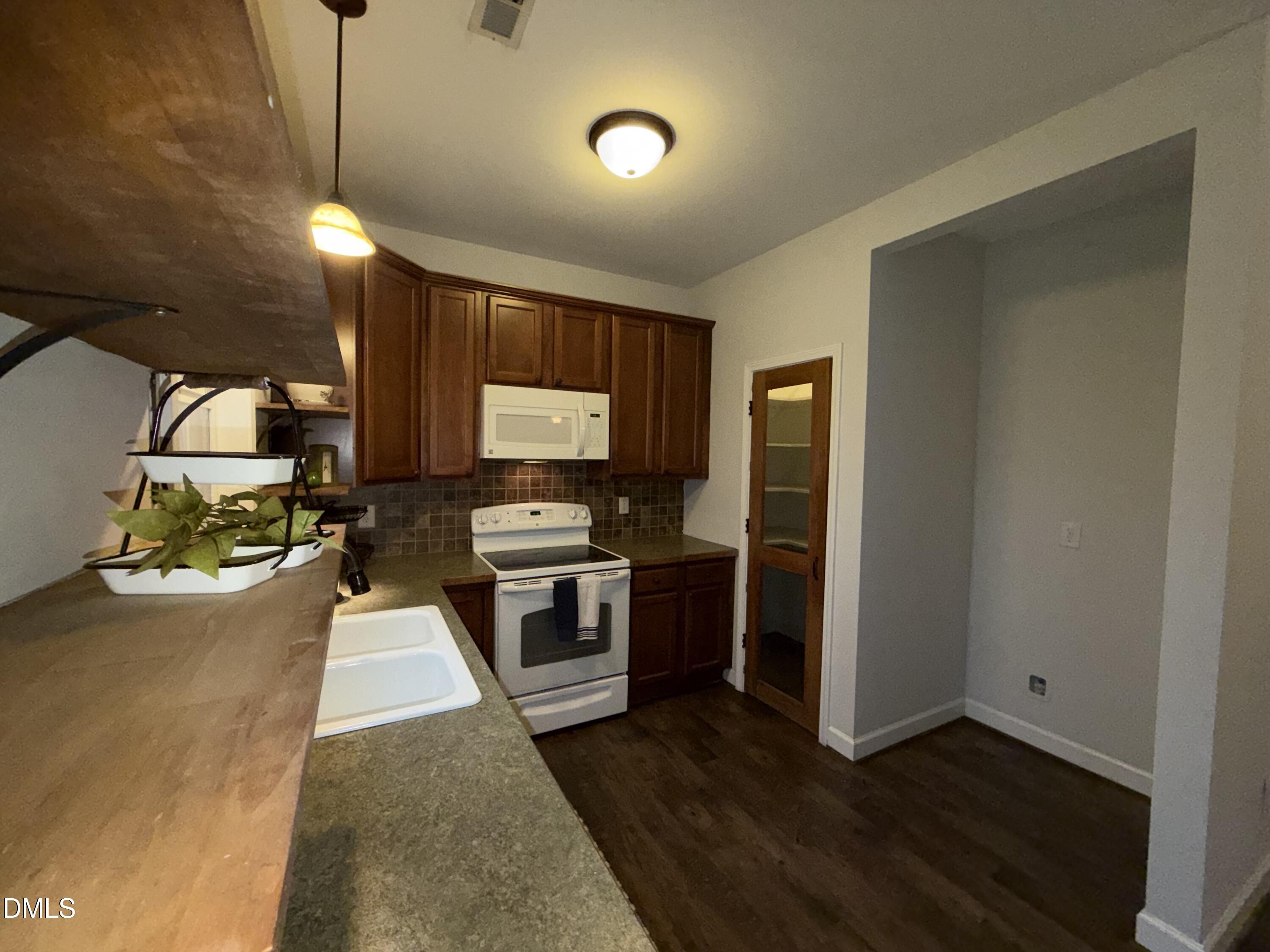 2733 Will Lucas Road Spring Lake, NC 28390 - Photo 7 of 21 a view of a kitchen with sink stainless steel appliances and cabinets