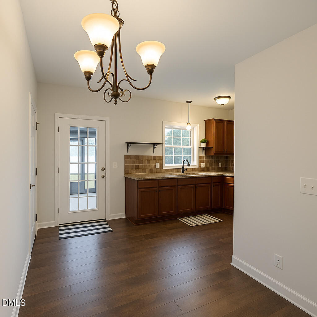 2733 Will Lucas Road Spring Lake, NC 28390 - Photo 7 of 25 a kitchen with kitchen island a counter space a sink appliances and cabinets