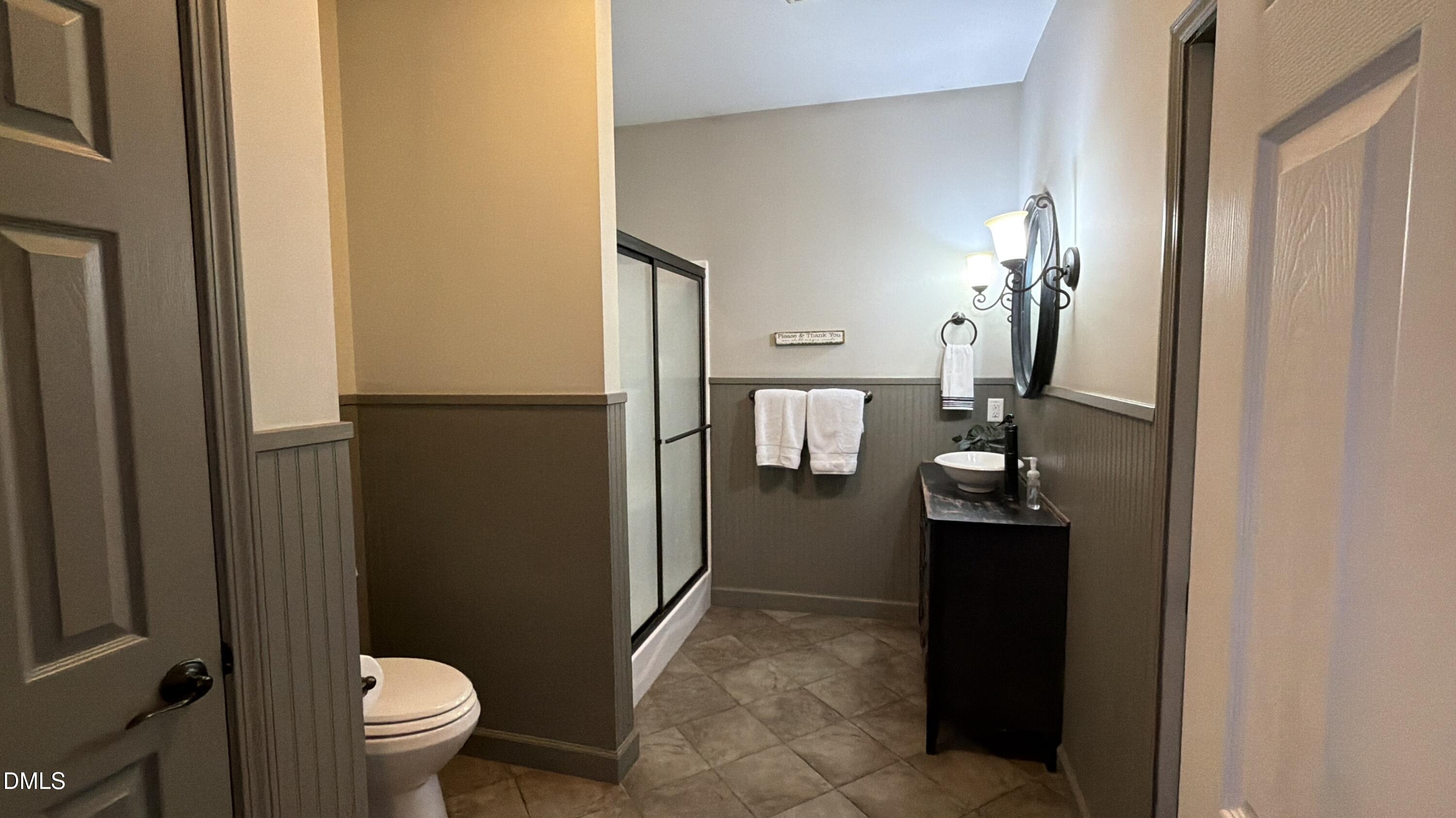 2733 Will Lucas Road Spring Lake, NC 28390 - Photo 9 of 21 a bathroom with a sink a toilet and shower
