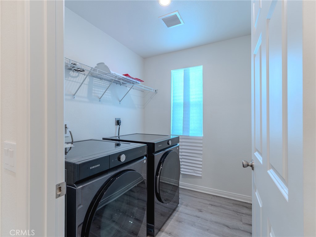 25602 Pne Rdg Road Homeland, CA 92548 - Photo 17 of 35 a room that has a window and wooden floor