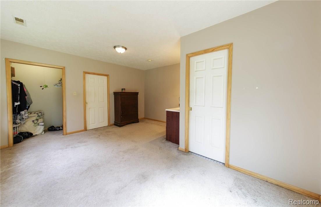 7555 Territorial Road Munith, MI 49259 - Photo 11 of 14 Territorial_7555_MasterBedroom_01.jpg