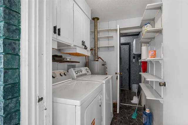 a view of a house with a yard and potted plants