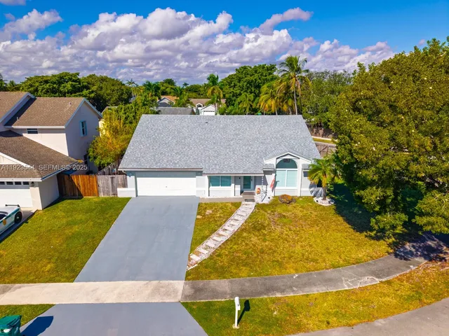 an aerial view of a house with swimming pool