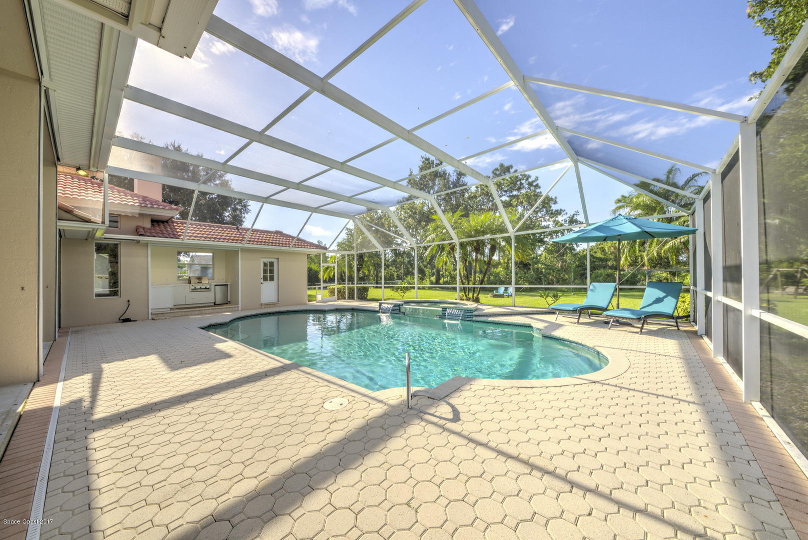 3755 Big Pine Road Melbourne, FL 32934 - Photo 57 of 73 Screen Enclosed Pool with Summer Kitchen