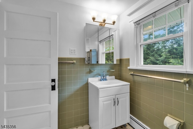 105 Somerville Road Bedminster, NJ 07921 - Photo 23 of 36 a bathroom with a sink a toilet and shower
