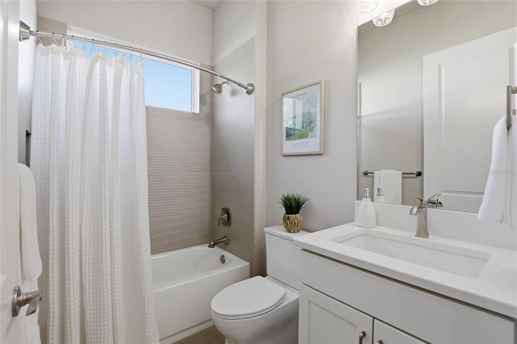 13425 Southwest 9th Road Newberry, FL 32669 - Photo 27 of 46 a bathroom with a sink a toilet a tub and shower