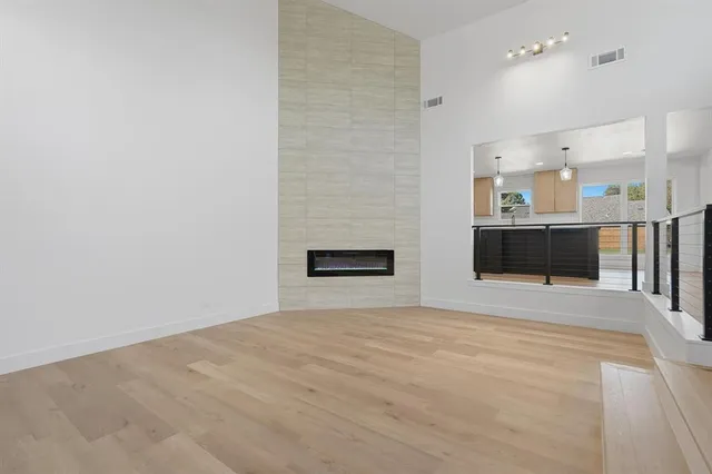 a kitchen with kitchen island a sink stainless steel appliances and cabinets