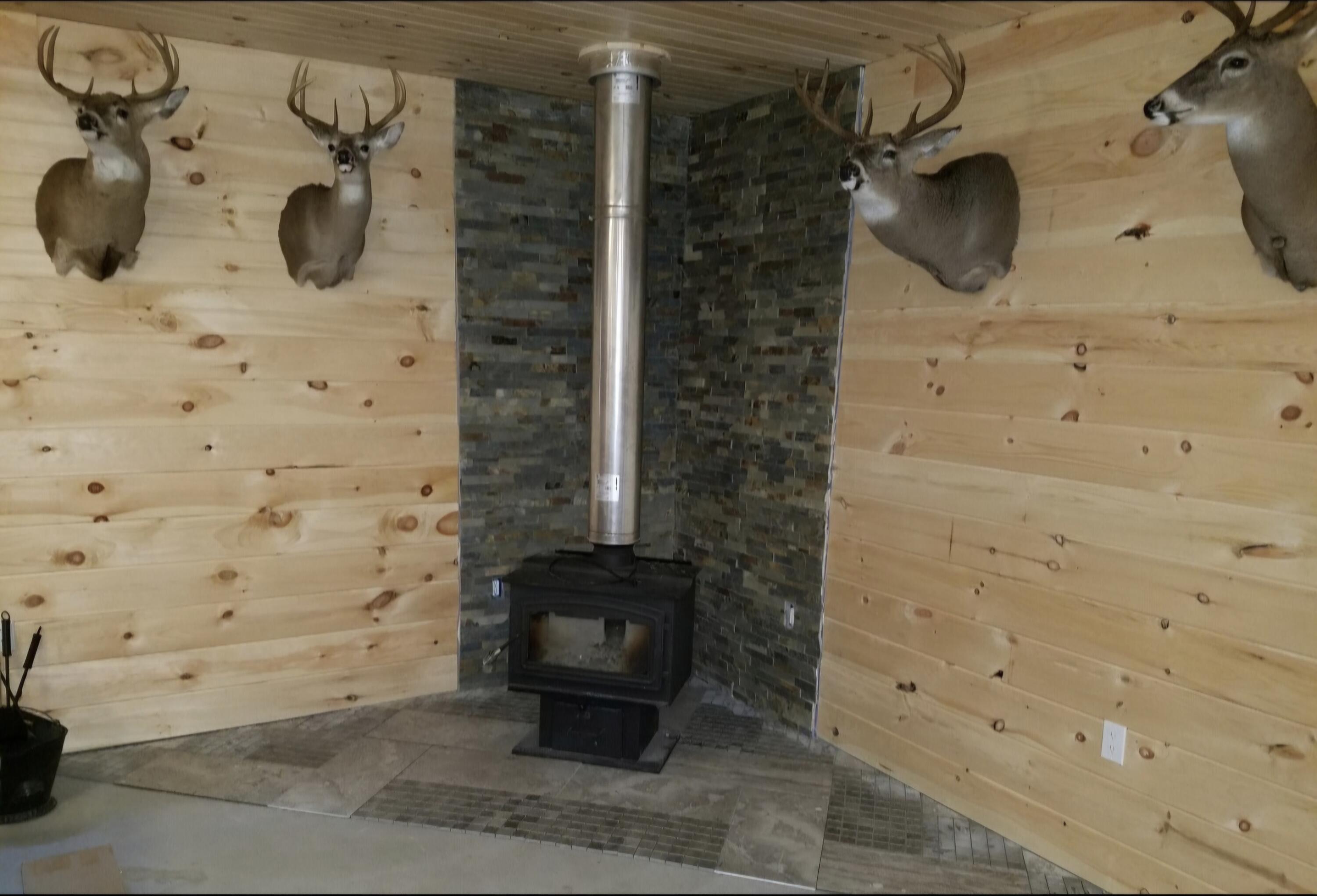 7423 South Nelson Road Chase, MI 49623 - Photo 17 of 20 Photo Jake Mounts & Wood Stove JPG