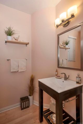 a bathroom with a sink vanity and a mirror