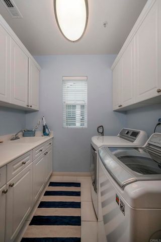 a kitchen that has a sink and a stove