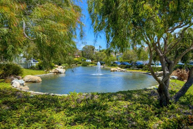 a view of water pond with yard