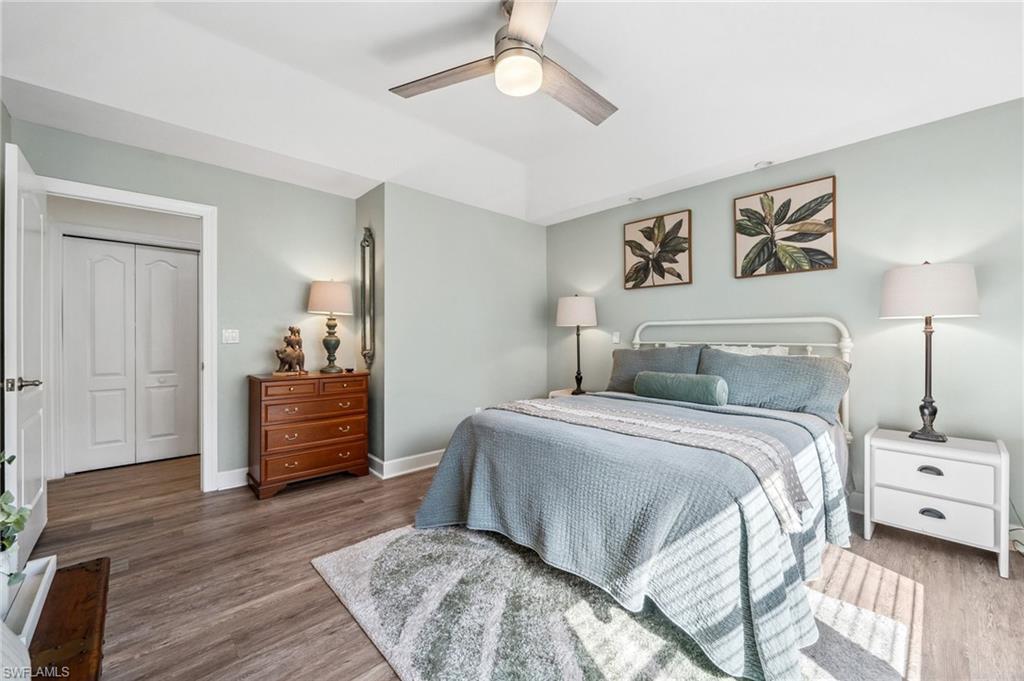 6857 Mill Run Road Naples, FL 34109 - Photo 33 of 49 Bedroom featuring ceiling fan, baseboards, and wood finished floors