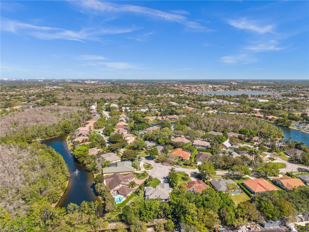 6857 Mill Run Road Naples, FL 34109 - Photo 47 of 49 Birds eye view of property featuring a water view and a residential view