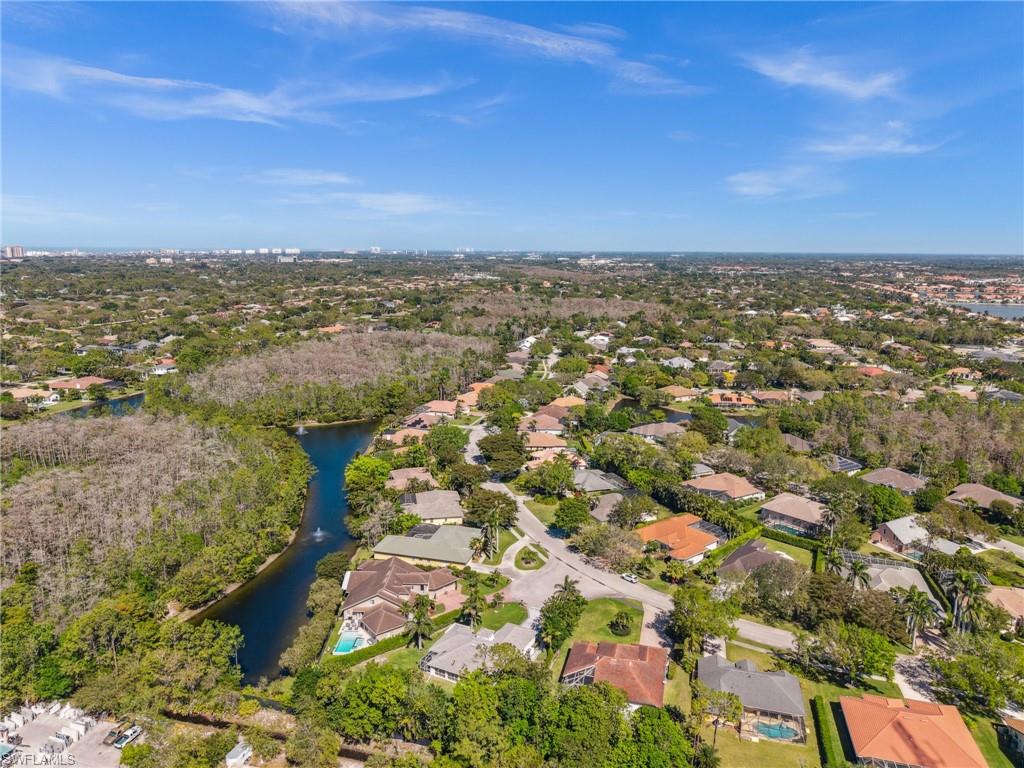 6857 Mill Run Road Naples, FL 34109 - Photo 48 of 49 Birds eye view of property featuring a water view and a residential view