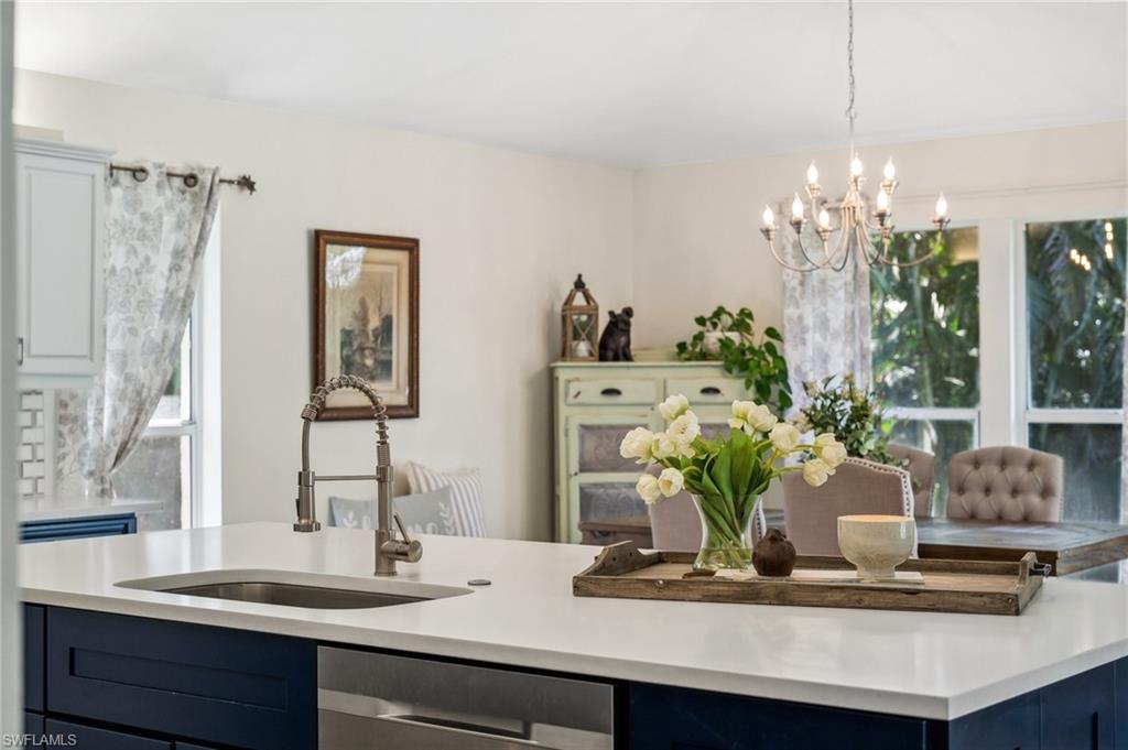 6857 Mill Run Road Naples, FL 34109 - Photo 5 of 49 Kitchen with dishwasher, light countertops, and a sink
