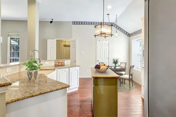 a view of a kitchen and dining room
