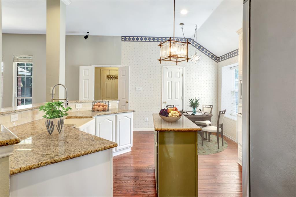 1315 Ballantrae Drive Allen, TX 75013 - Photo 11 of 26 a view of a kitchen and dining room