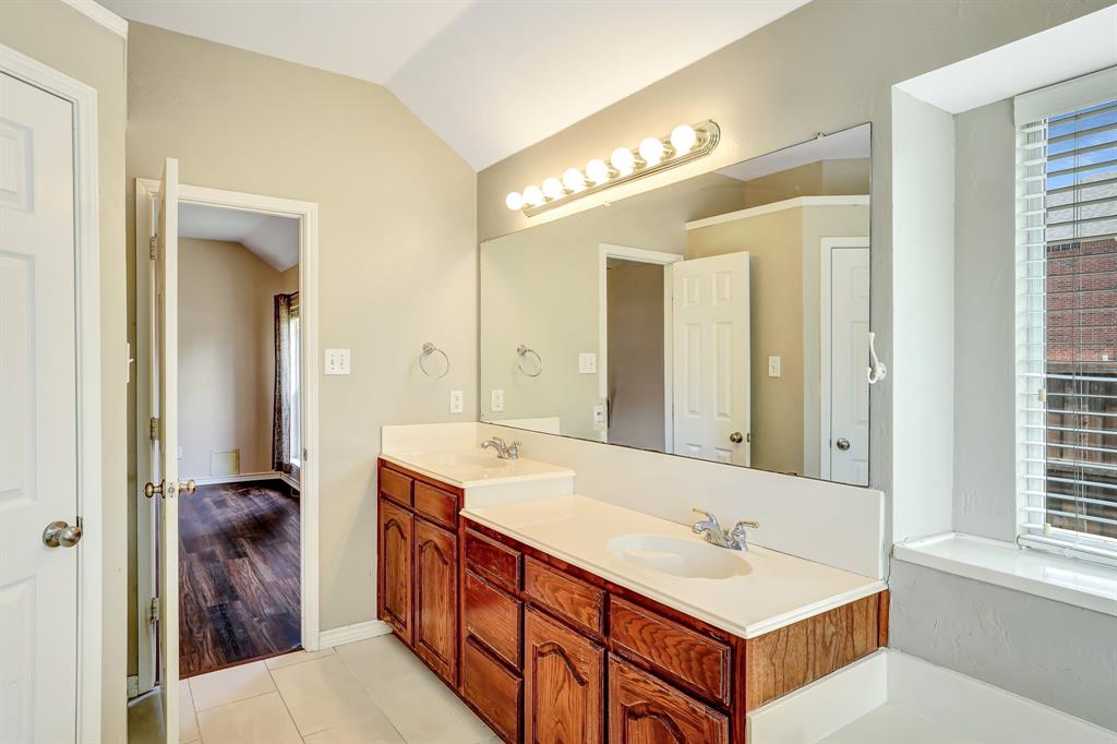 1315 Ballantrae Drive Allen, TX 75013 - Photo 17 of 26 a bathroom with a double vanity sink and a mirror