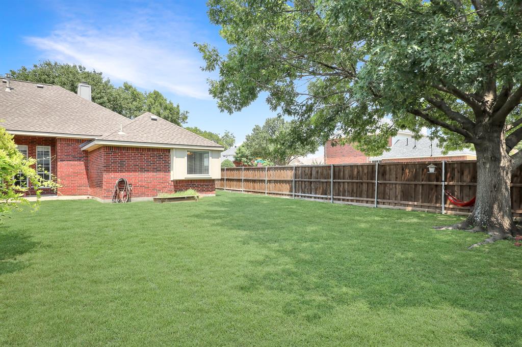 1315 Ballantrae Drive Allen, TX 75013 - Photo 25 of 26 a view of a backyard with a garden and plants