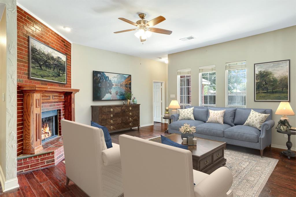 1315 Ballantrae Drive Allen, TX 75013 - Photo 4 of 26 a living room with fireplace furniture and a flat screen tv