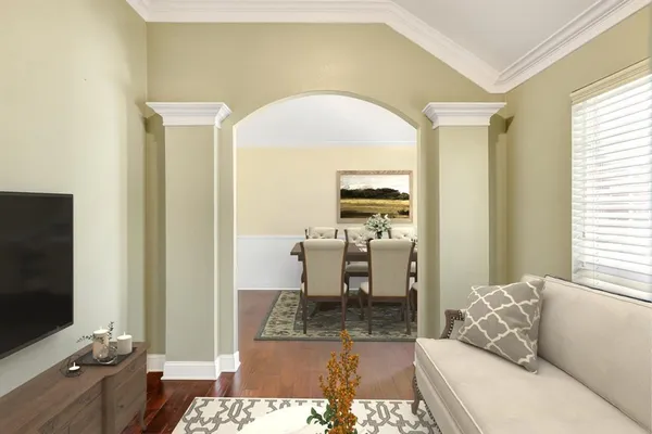 a living room with furniture and a flat screen tv