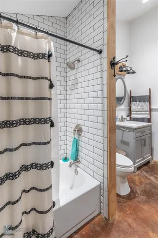 a bathroom with a toilet and a sink