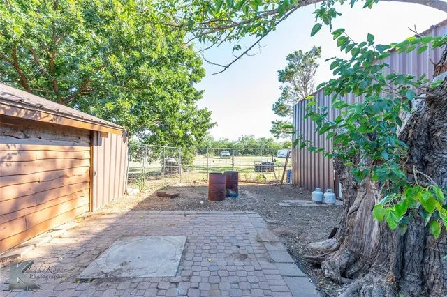 a backyard of a house with seating space