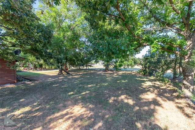 an outdoor space with furniture and garden