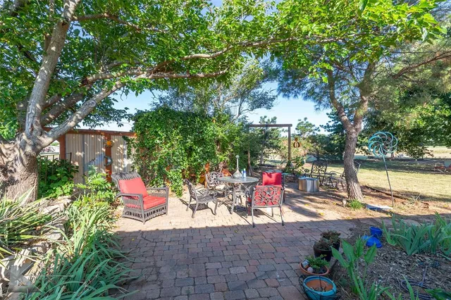 a view of a water fountain and a fountain in the yard
