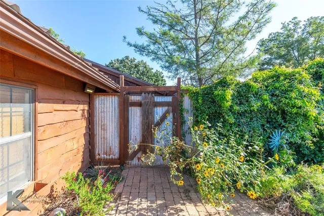 a view of a backyard with plants