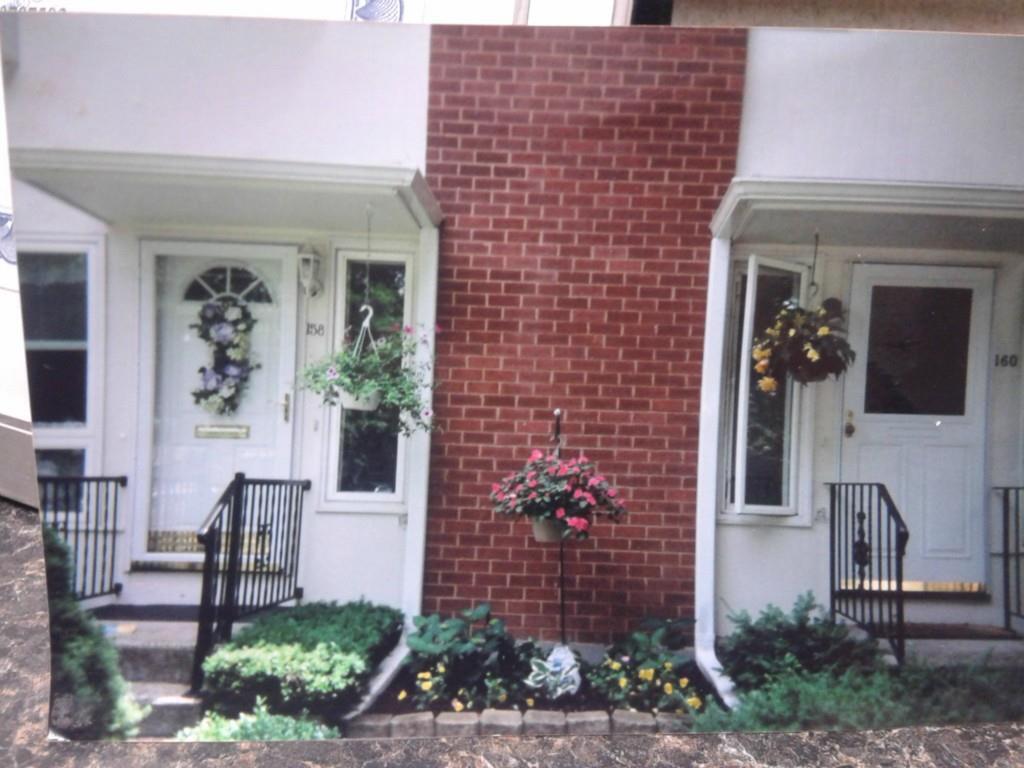 158 Centerbrook Road, Unit 158 Hamden, CT 06518 - Photo 1 of 1 Exterior with beautiful perrenials and new full view glass front door!