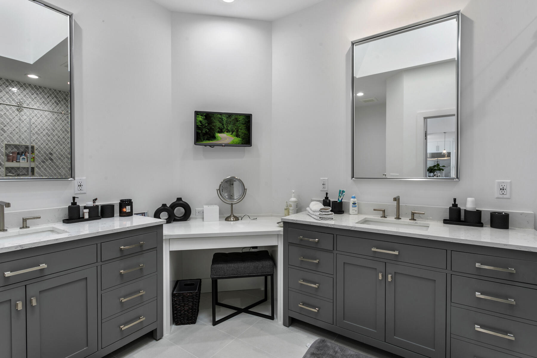 245 Regatta Drive Jupiter, FL 33477 - Photo 23 of 51 a bathroom with a double vanity sink and mirror