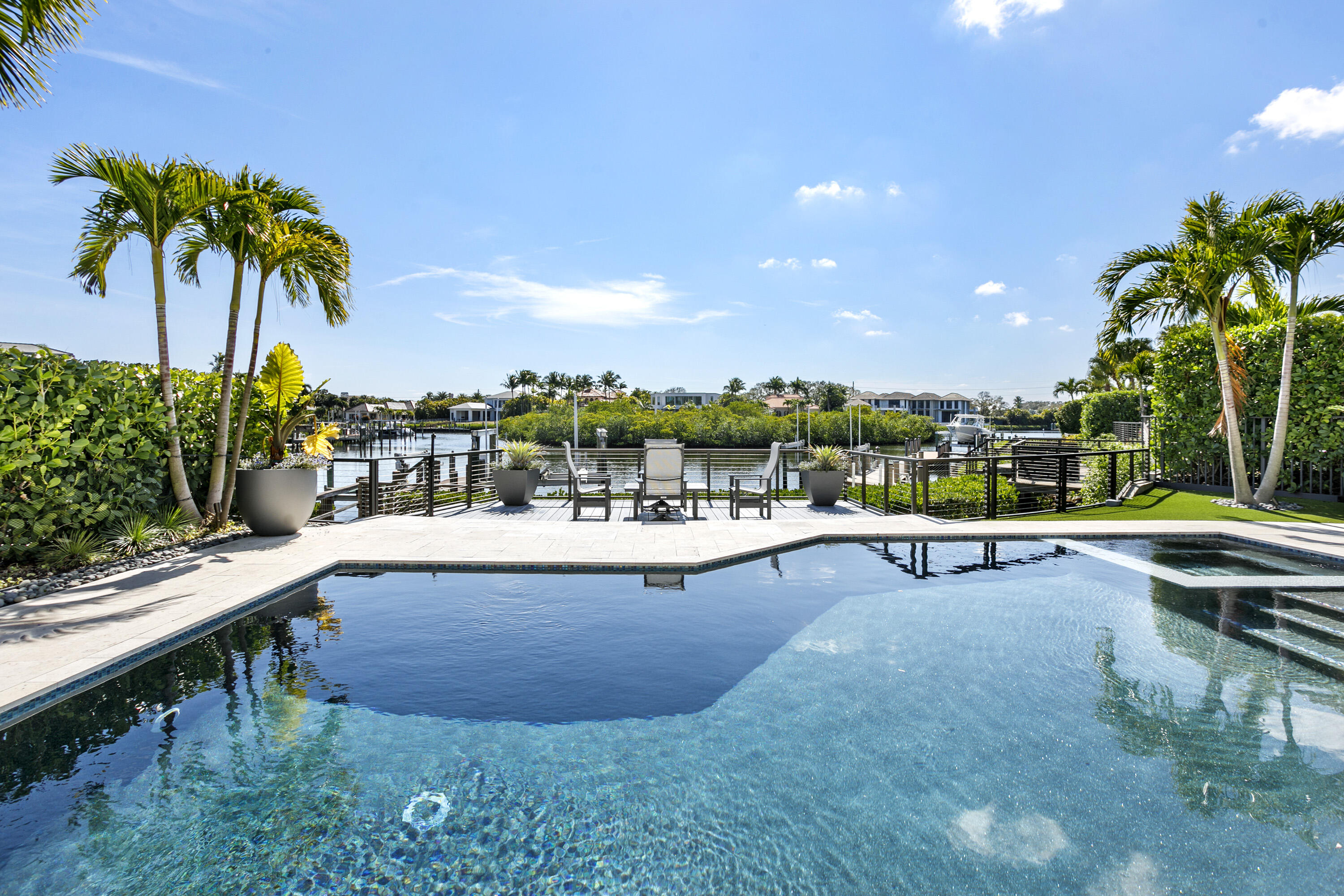 245 Regatta Drive Jupiter, FL 33477 - Photo 28 of 51 a view of swimming pool with outdoor seating and plants