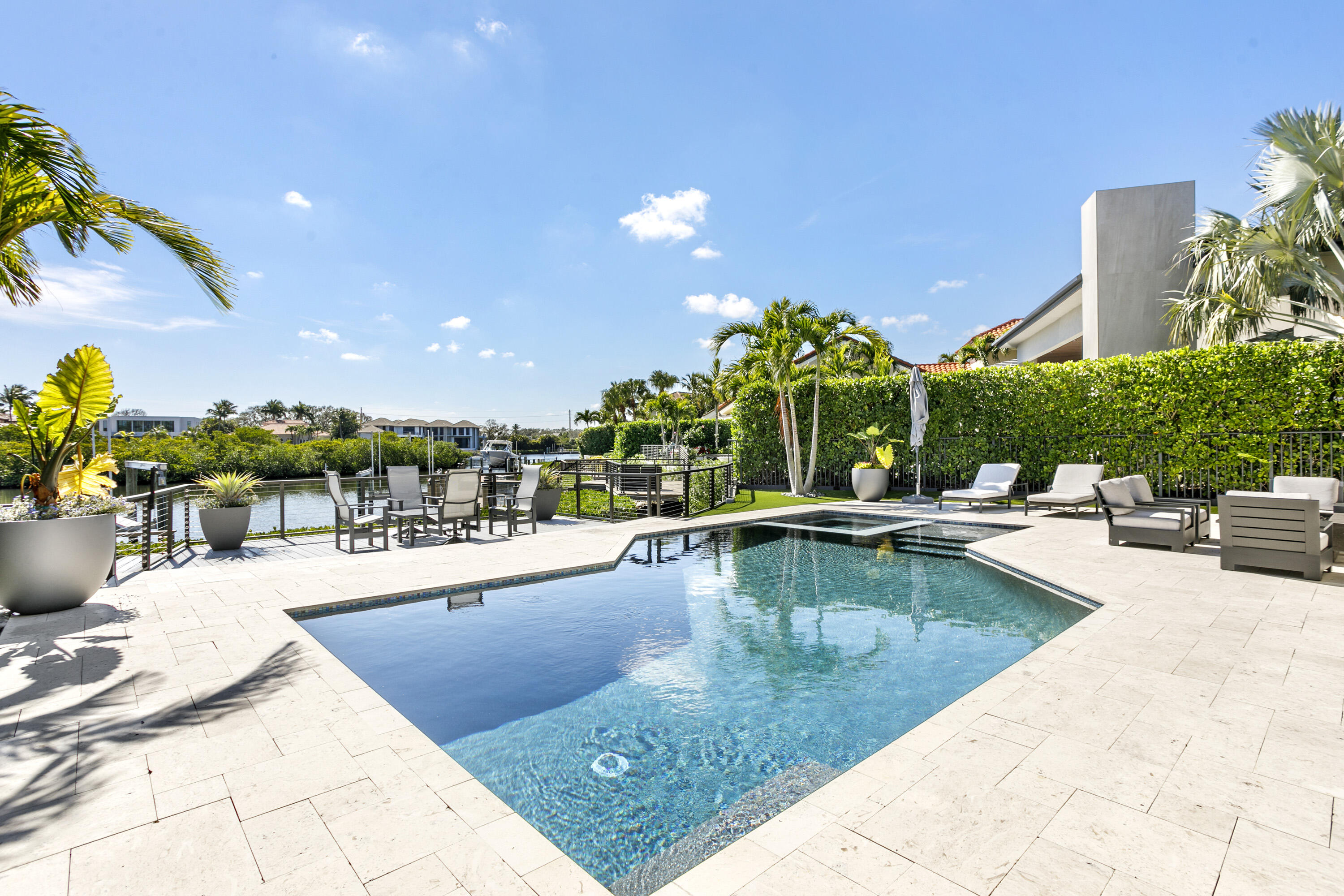 245 Regatta Drive Jupiter, FL 33477 - Photo 30 of 51 a view of a swimming pool with outdoor seating