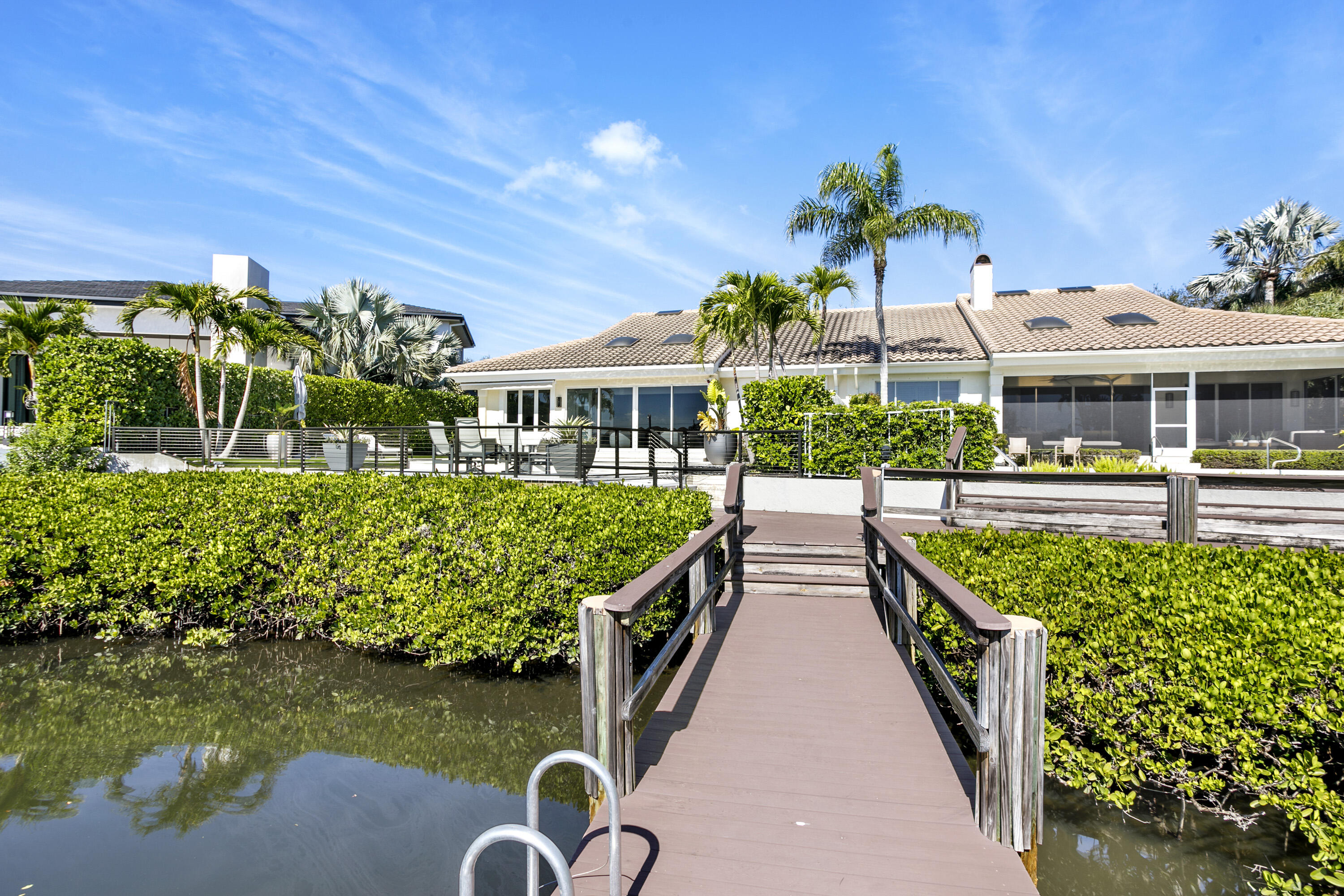 245 Regatta Drive Jupiter, FL 33477 - Photo 33 of 51 a view of a swimming pool with a patio