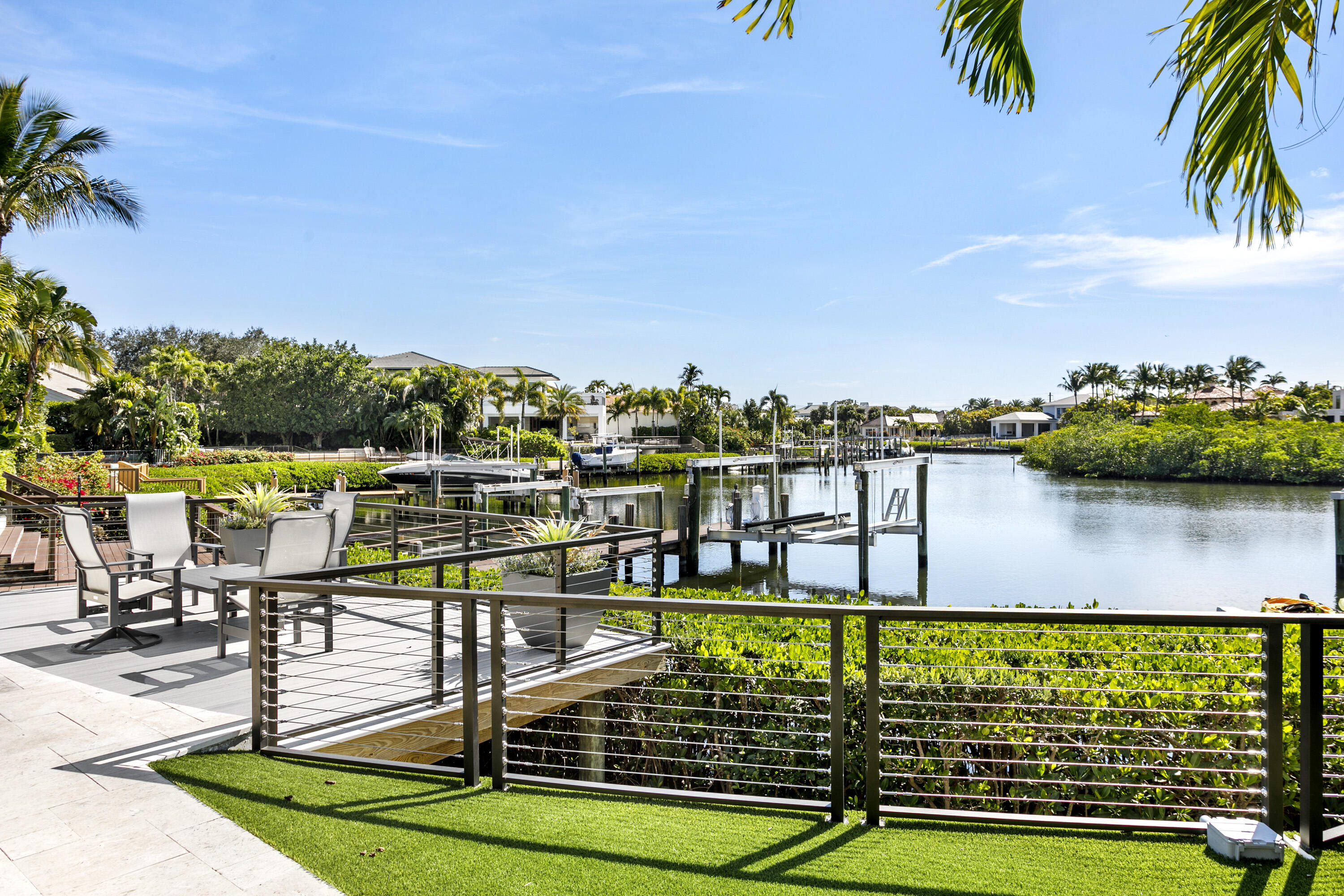 245 Regatta Drive Jupiter, FL 33477 - Photo 38 of 51 a view of a water fountain and trees in the background