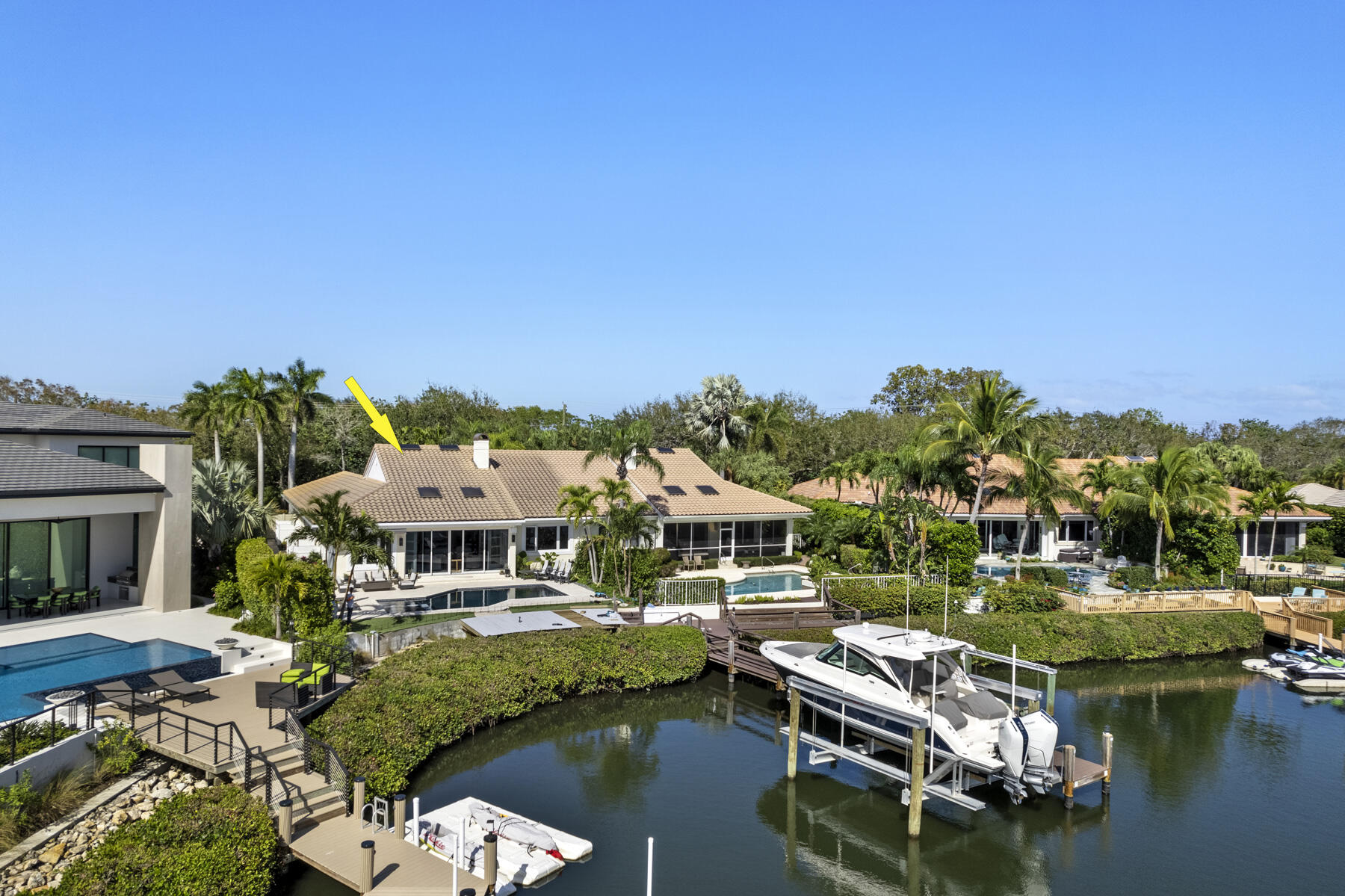 245 Regatta Drive Jupiter, FL 33477 - Photo 46 of 51 a view of house with swimming pool yard and outdoor seating
