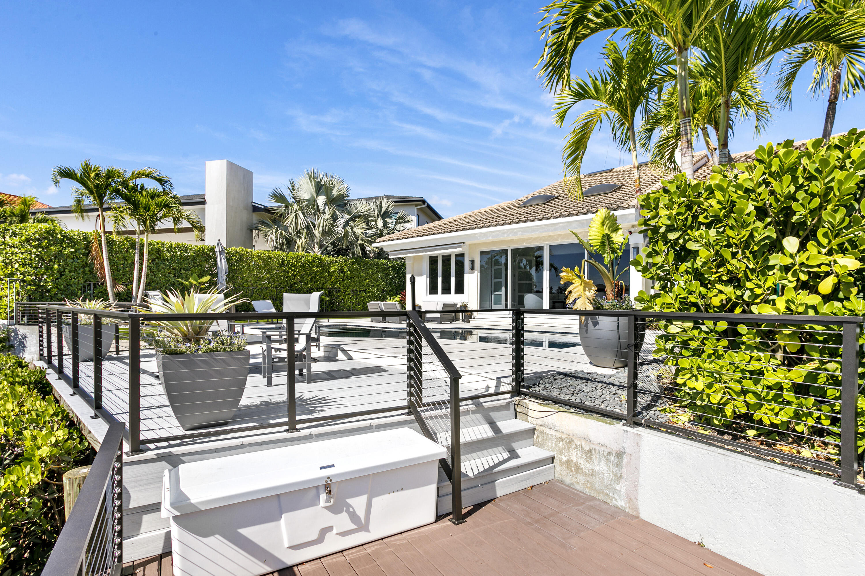 245 Regatta Drive Jupiter, FL 33477 - Photo 47 of 51 a view of house with swimming pool and sitting area