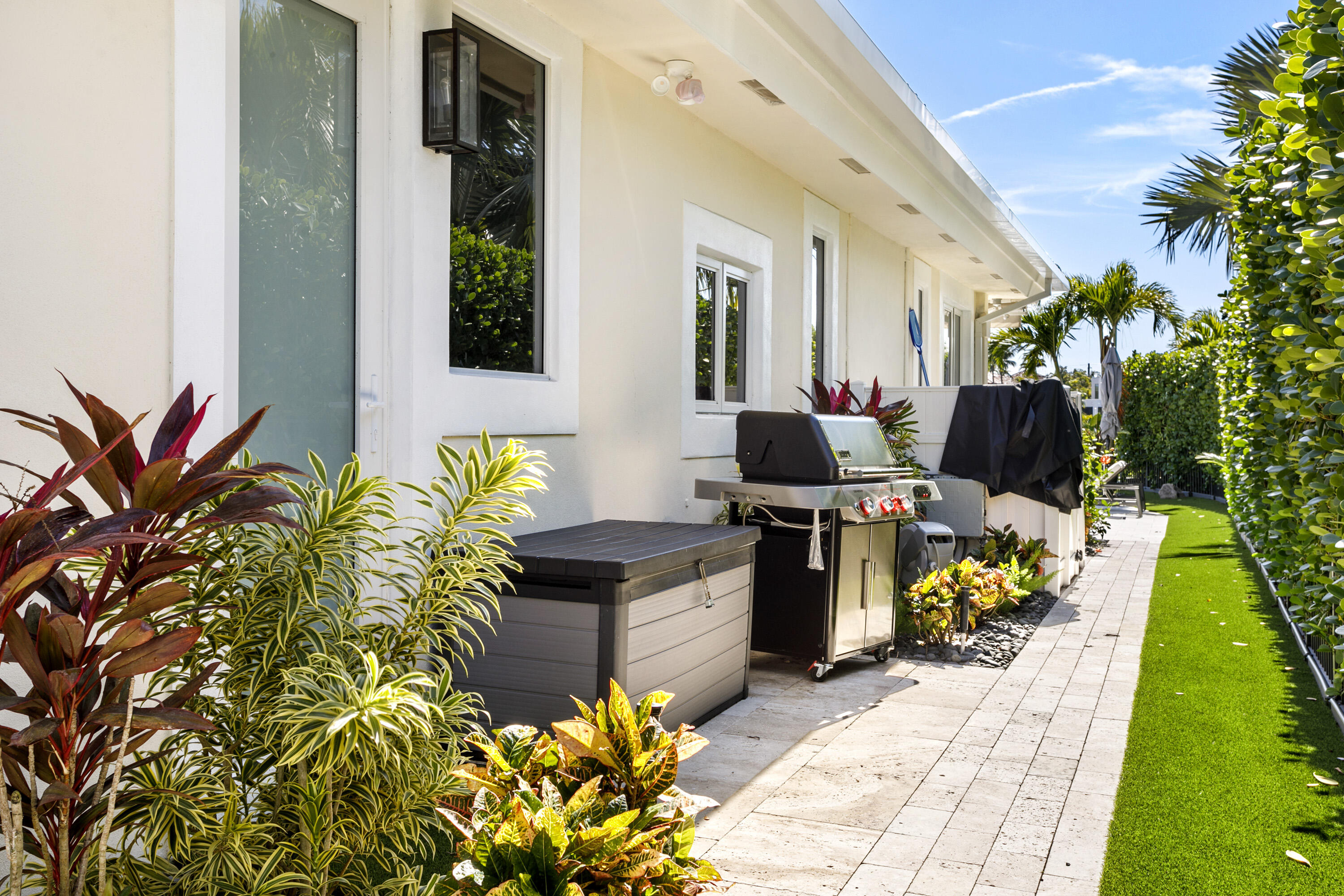 245 Regatta Drive Jupiter, FL 33477 - Photo 51 of 51 a front view of a house with a garden