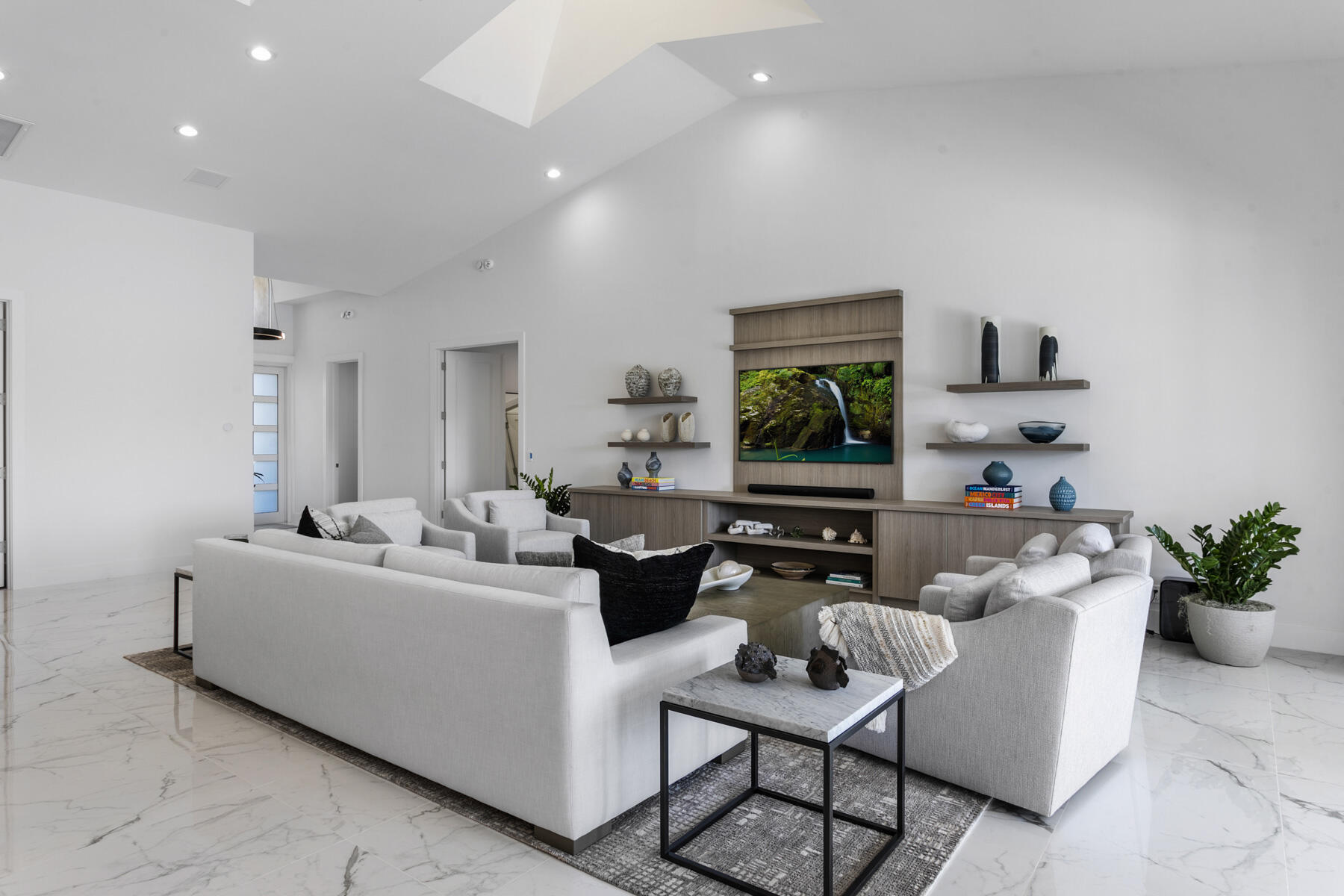 245 Regatta Drive Jupiter, FL 33477 - Photo 8 of 51 a living room with furniture and a flat screen tv